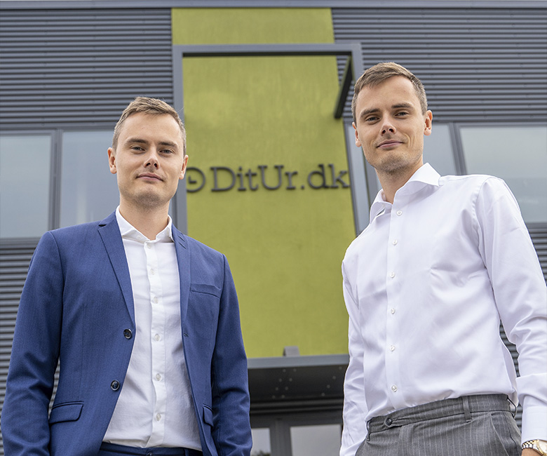 Kasper and Mikkel photographed in front of Ditur headquarters