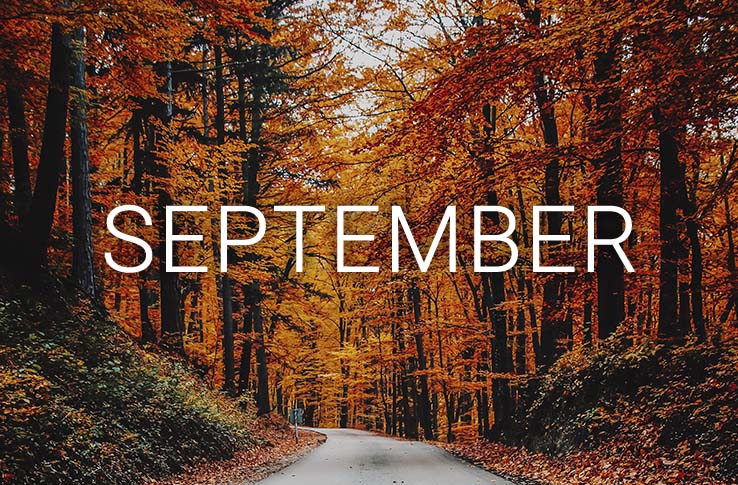 An autumn forest with the text September